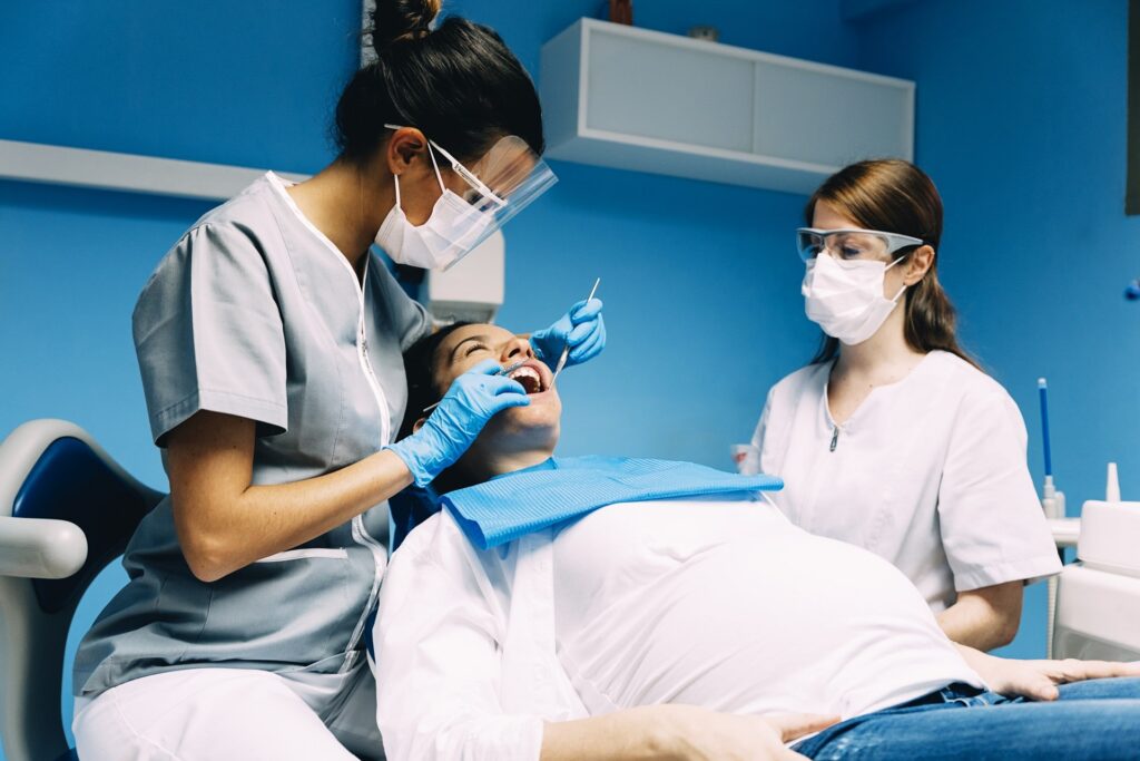 pregnant girl on her dental session