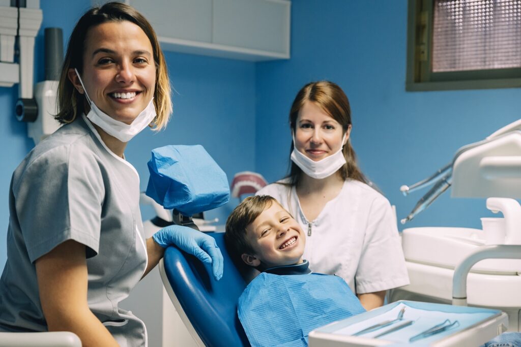 boy smiling before a dental session